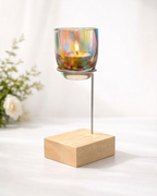 Glassybaby Candle holder with a colorful glass container and wooden base on a white background
